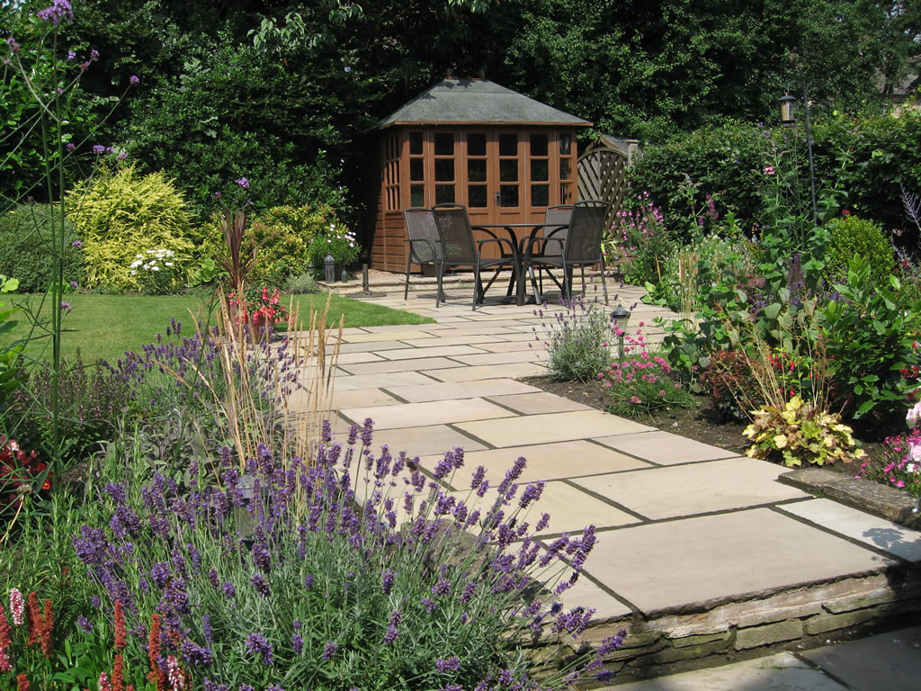 Sandstone patio and pathway in a UK garden